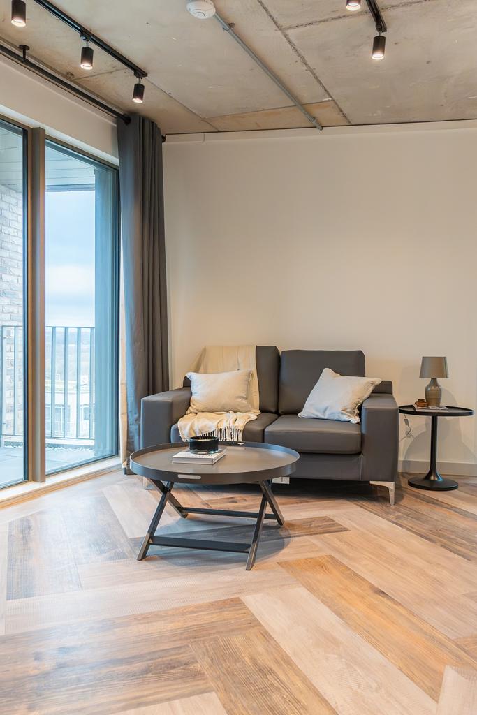 A bright and spacious modern living room featur...