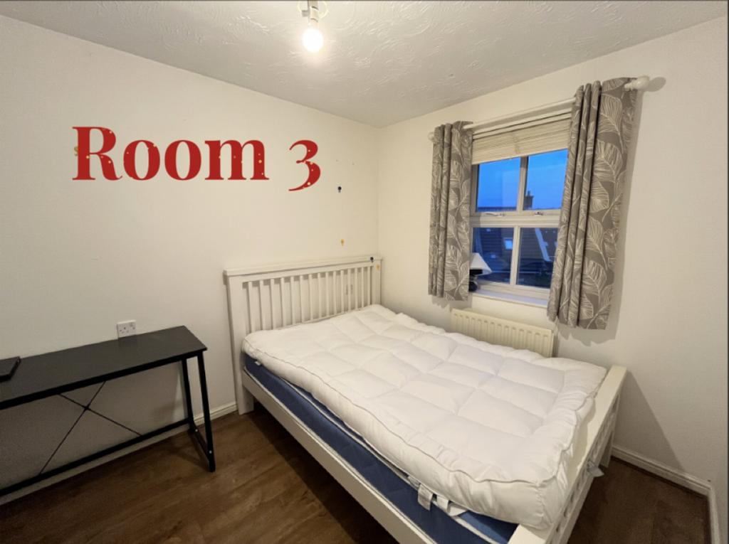 A bright and spacious double bedroom with ample...