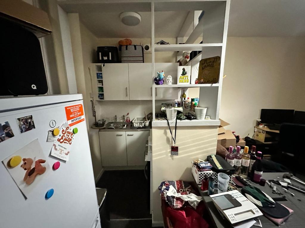 A cozy kitchenette with essential appliances, p...