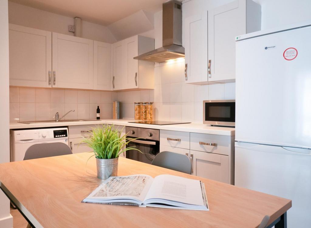A bright and modern kitchenette, perfect for st...