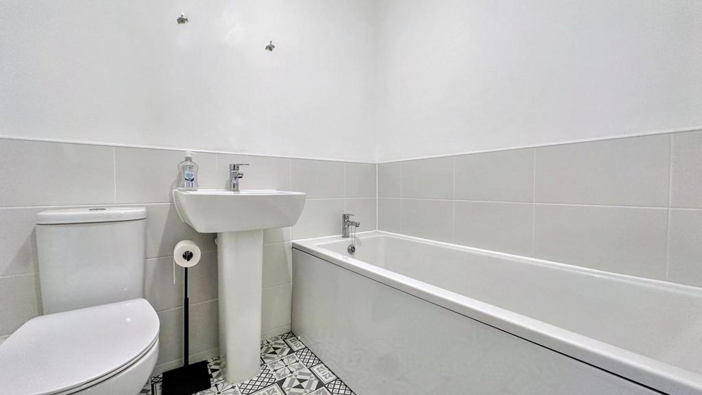 A modern and clean bathroom featuring stylish t...