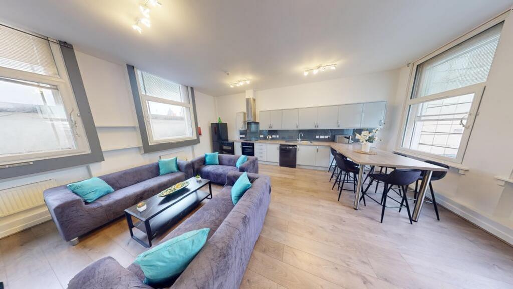 A spacious and modern living room with ample na...