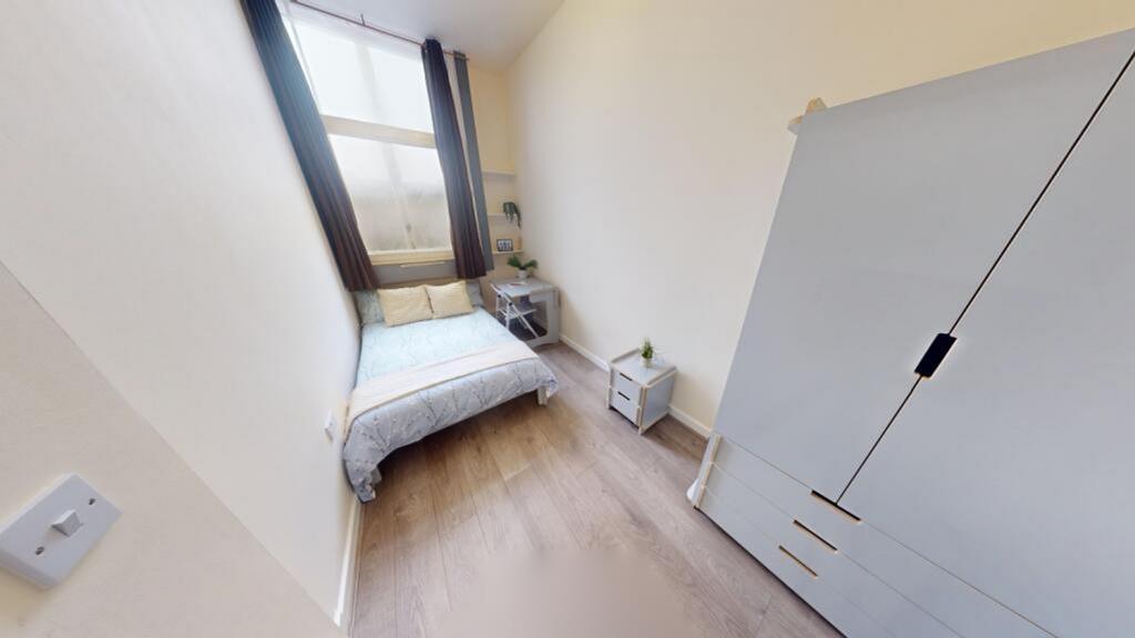 A bright and tidy double bedroom with ample nat...
