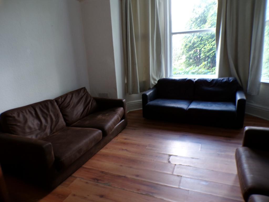 A spacious and inviting living room with ample ...