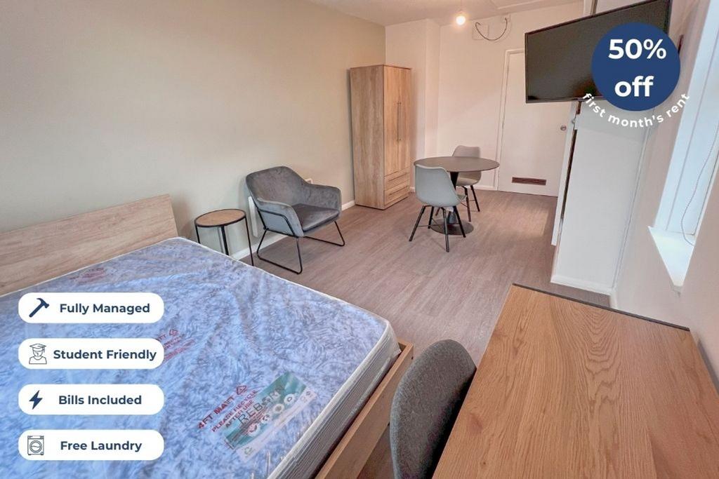 This cozy double bedroom features a comfortable...