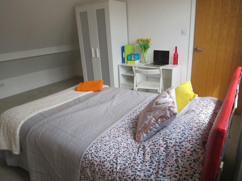 A bright and inviting double bedroom featuring ...