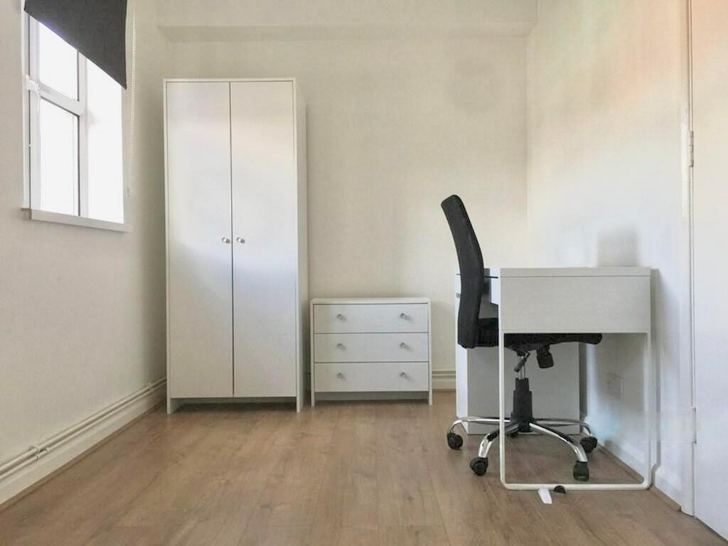 This inviting double bedroom features ample spa...
