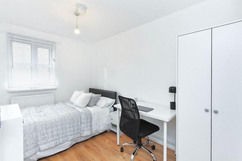 Bright and inviting double bedroom featuring a ...
