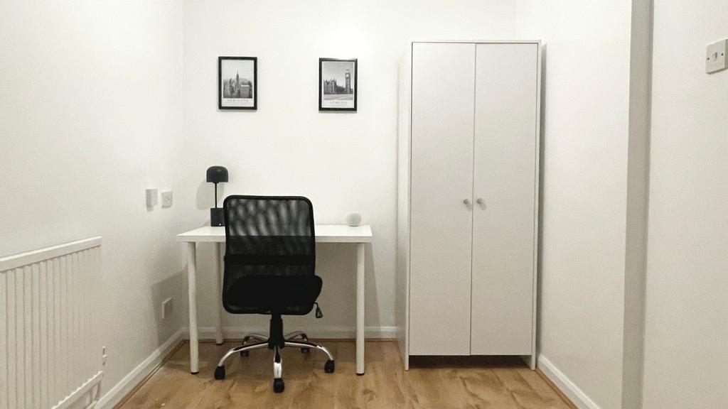 A bright and inviting communal workspace featur...