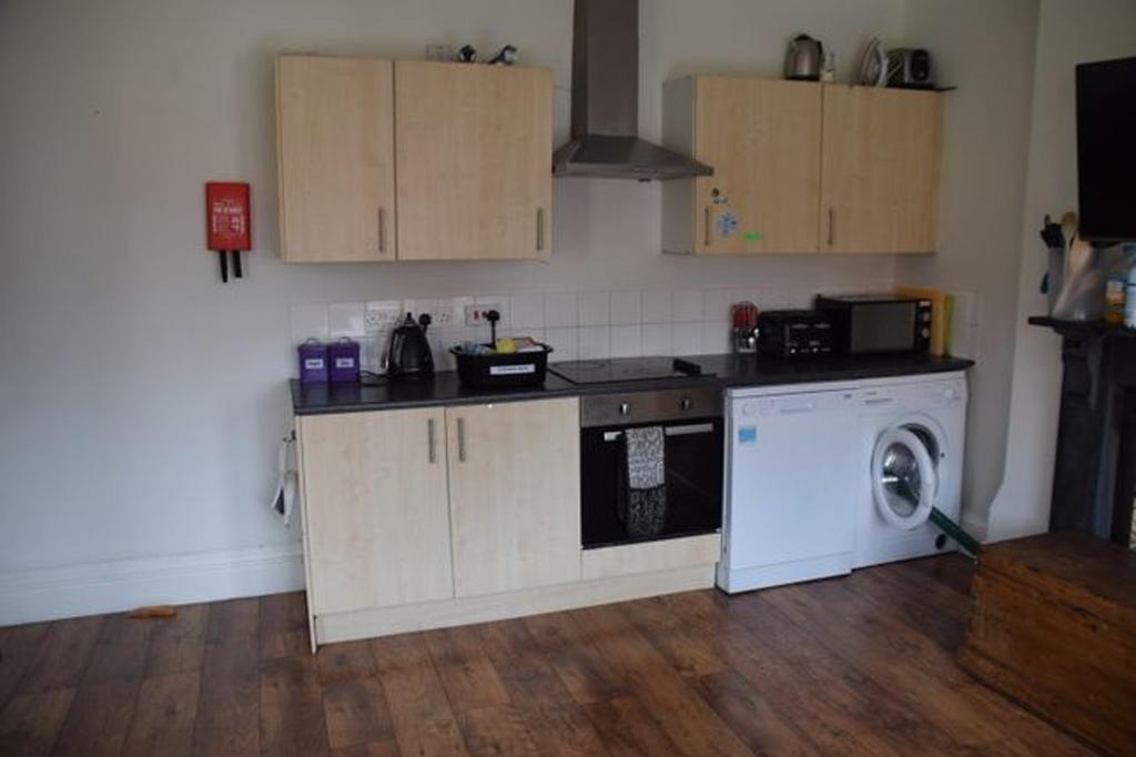 A tidy and functional kitchenette equipped with...