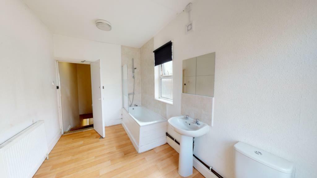 Bright and clean bathroom featuring a full-size...