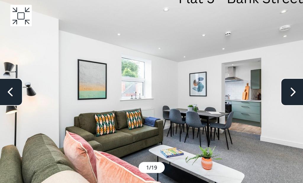 A spacious and stylish modern living room with ...