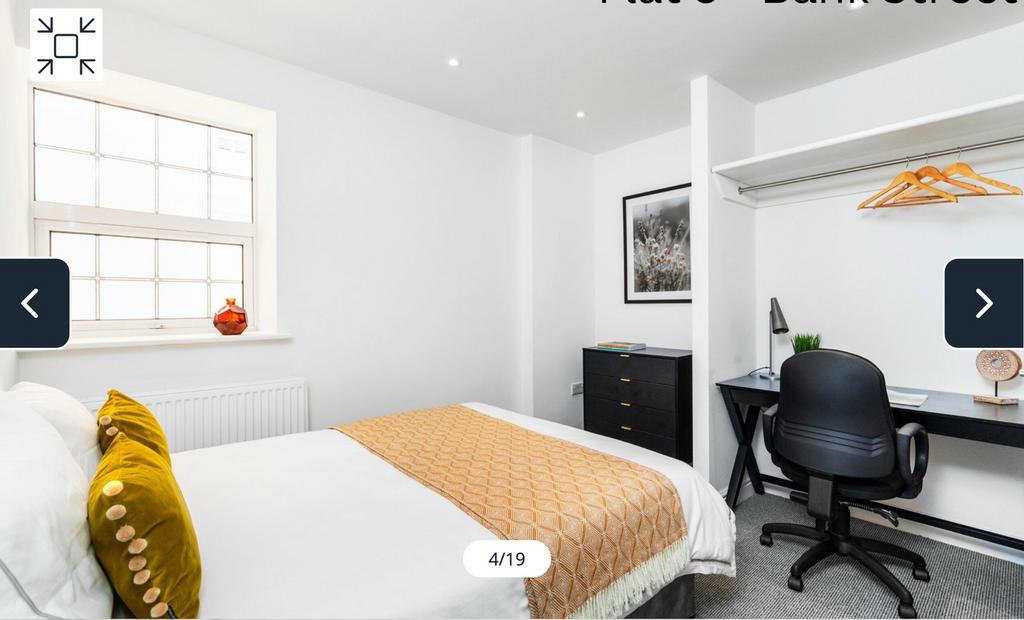 A bright and inviting double bedroom featuring ...