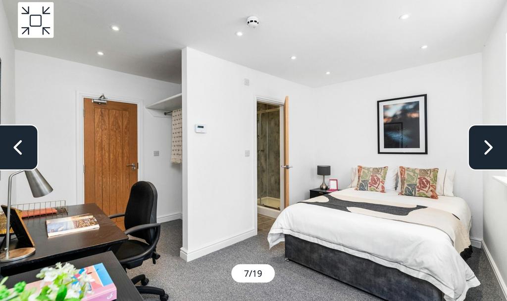 A spacious and bright double bedroom featuring ...