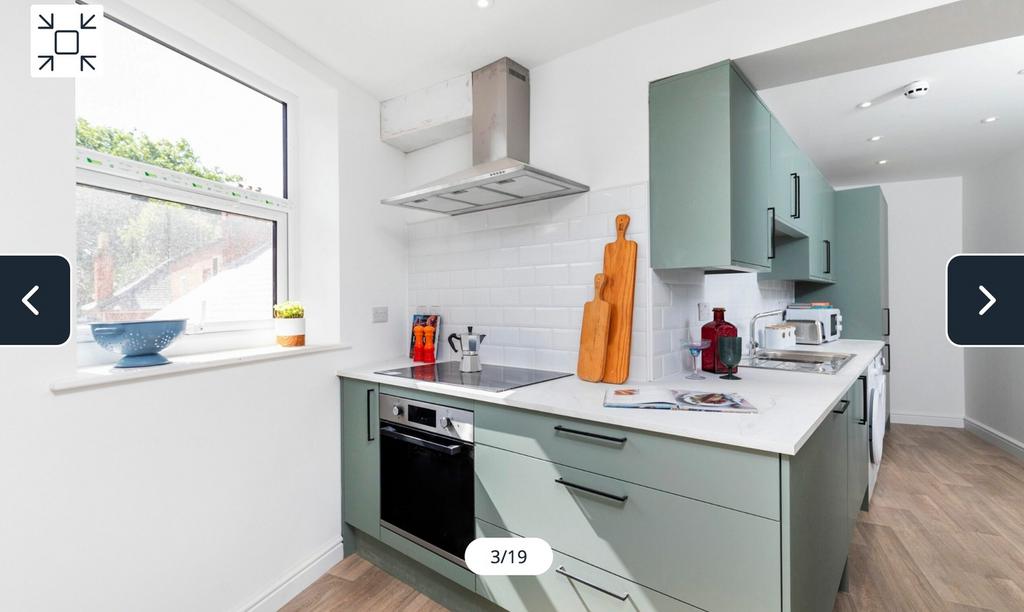 A bright and modern kitchenette featuring styli...