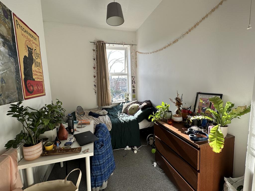 A cozy double bedroom filled with natural light...
