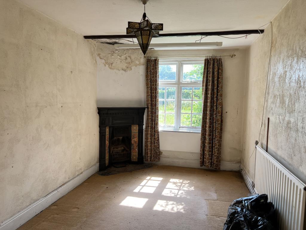 Dining room with fireplace and window to front gar