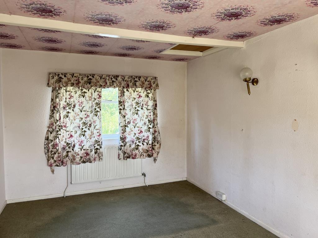 Bedroom one with window to rear garden