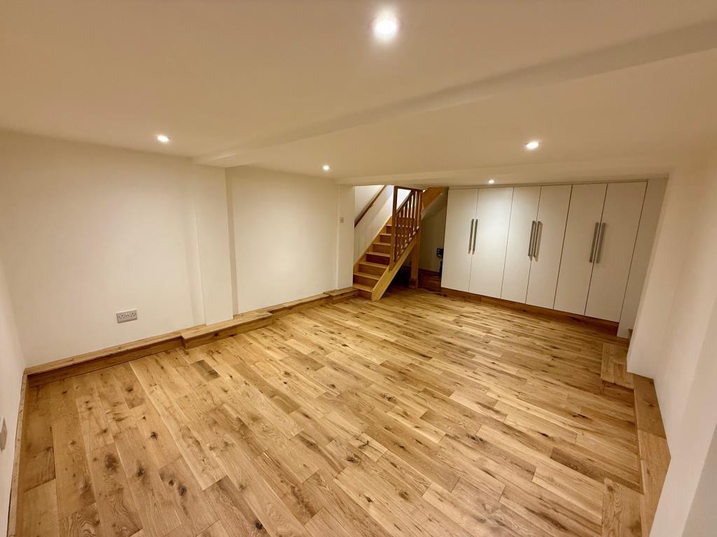 Basement room with laminate flooring