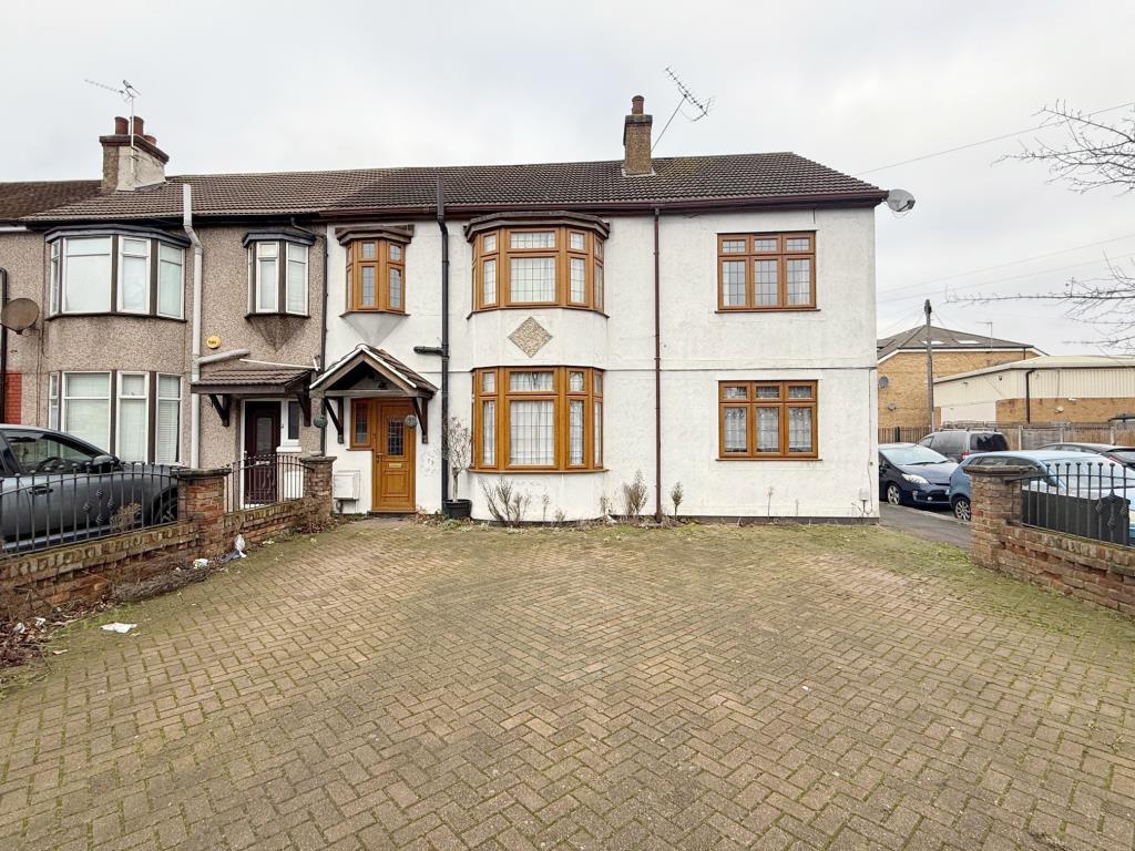 Wide block paved frontage leading to front door