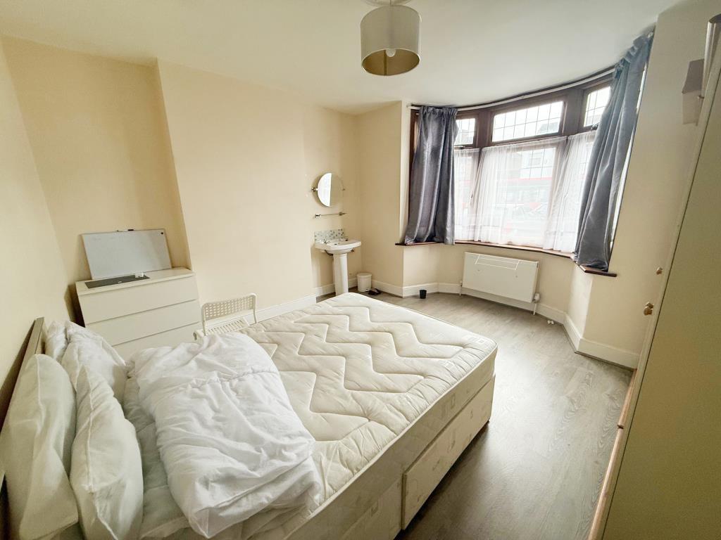 Ground floor room with sink and window to front as