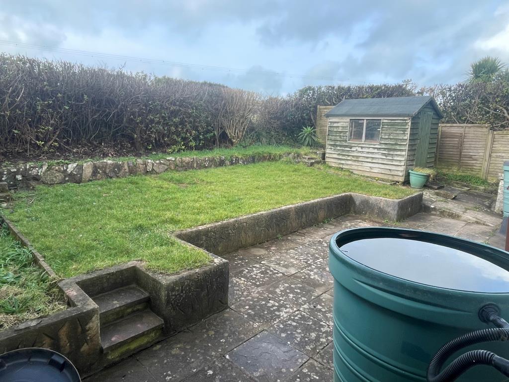 Rear garden with patio area and lawned area