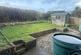 Rear garden with patio area and lawned area