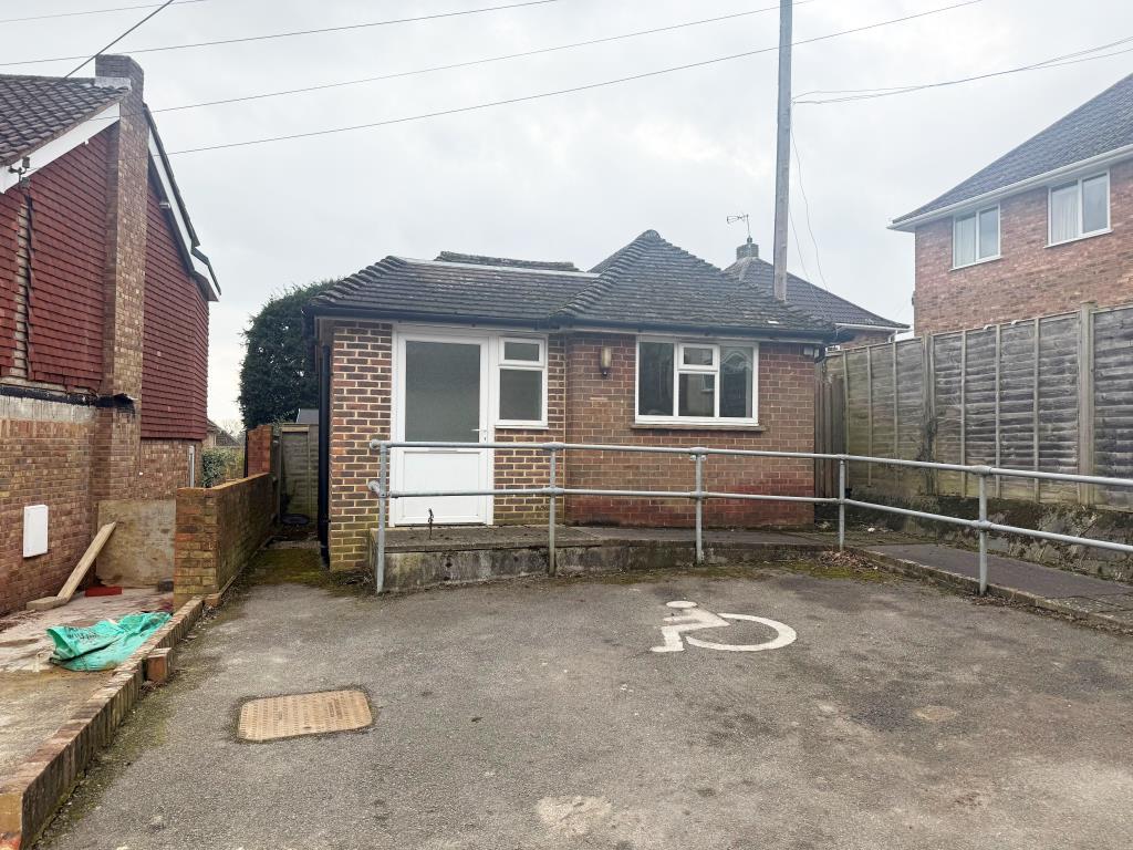 Detached single story former GP surgery