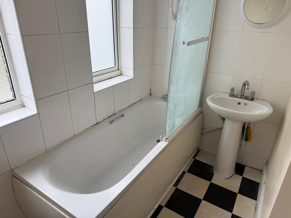 White bathroom suite with window