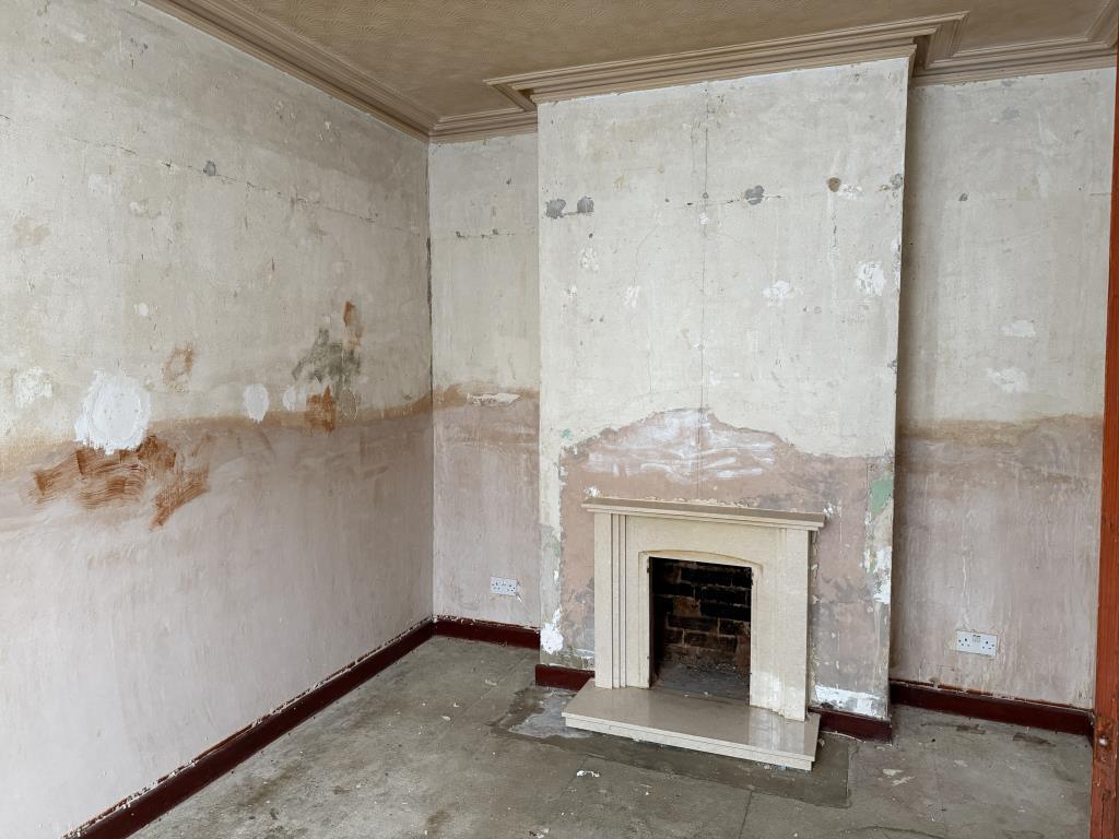Living room with plastered walls and fire place
