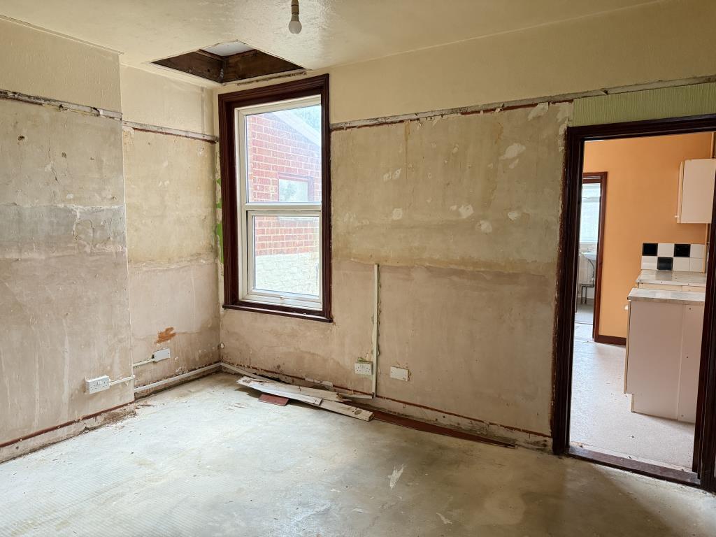 Dining room with kitchen in background