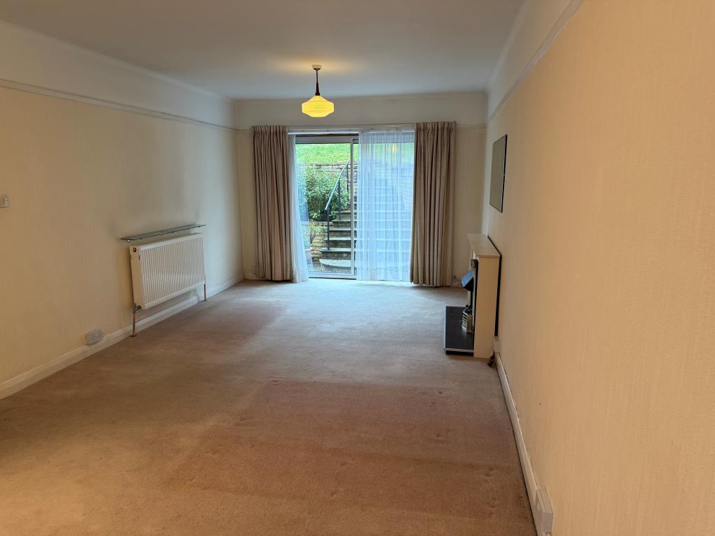 View of rear garden from living room sliding doors