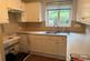 Fittted kitchen with white units
