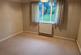 Second bedroom with window to rear