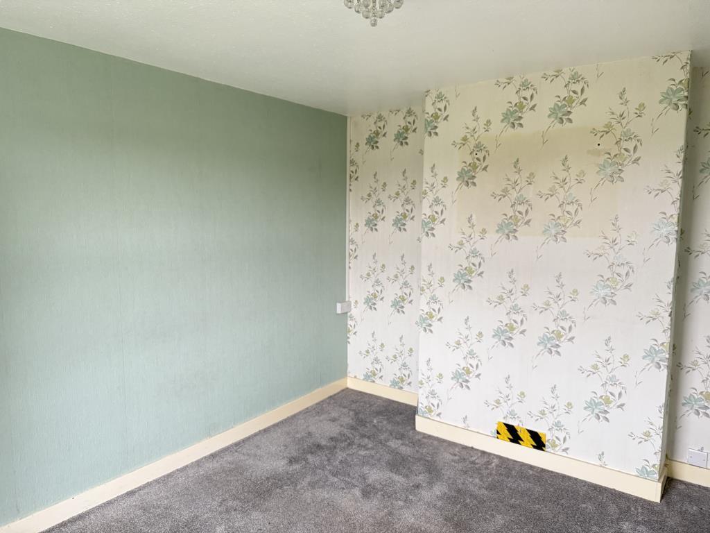 Front room with wallpaper and carpet