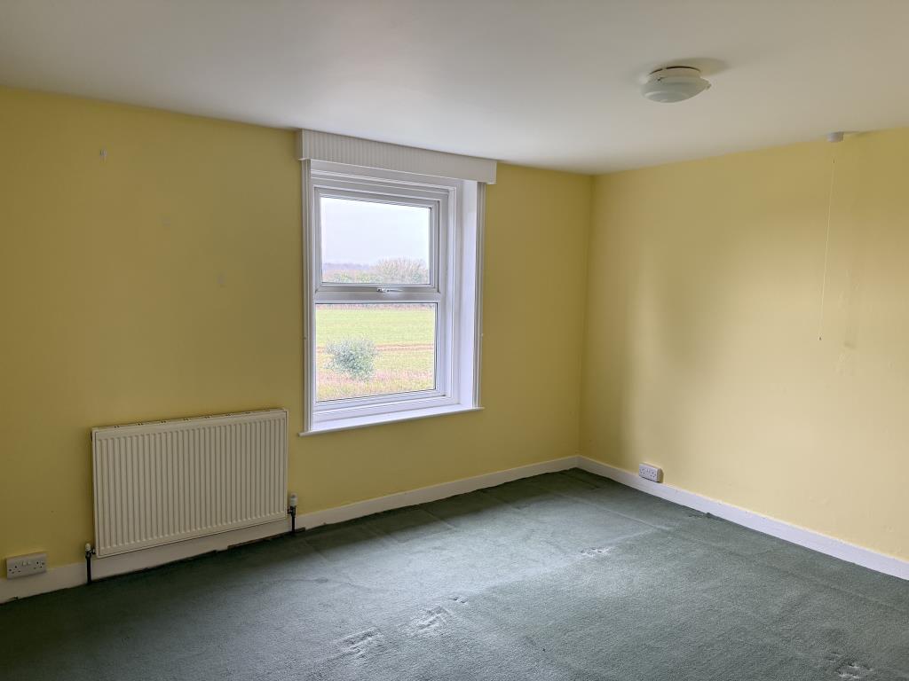 Bedroom one with view to fields