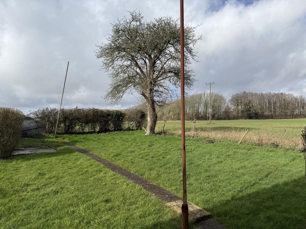 Garden with grass and view to surrounding fields