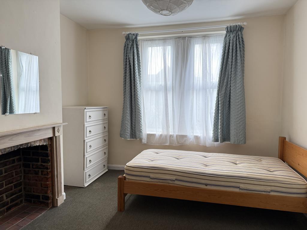 Ground floor front room with bedroom furniture