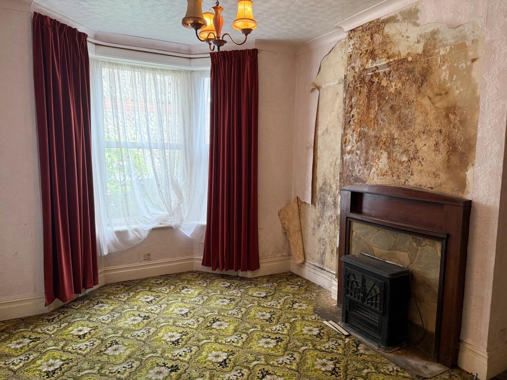 GF Bedroom with fireplace and window