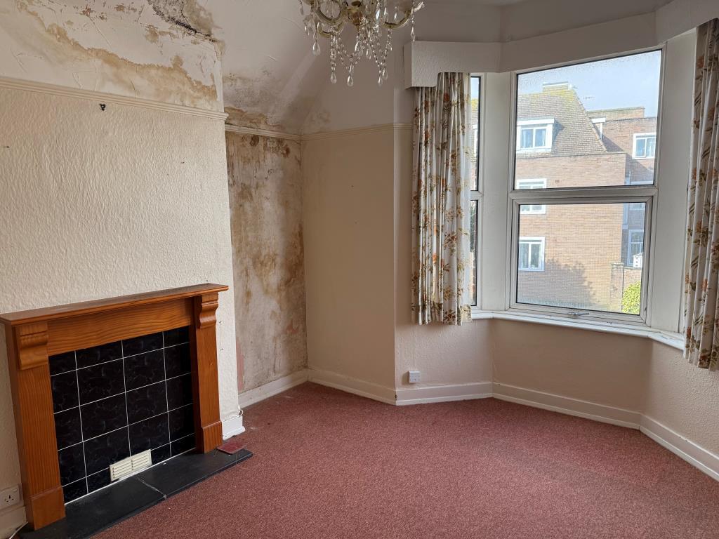 FF main bedroom with fireplace and window