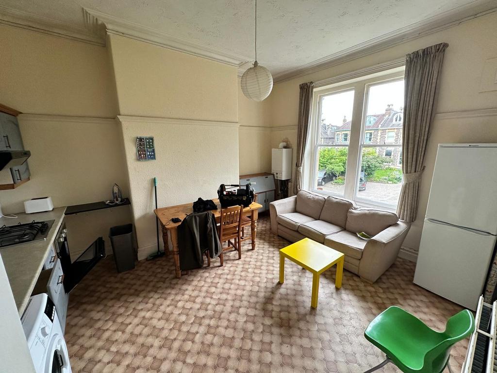 Bright, open living area with large bay window ...