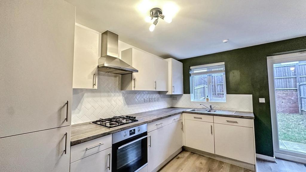 A modern and tidy kitchen with ample storage an...