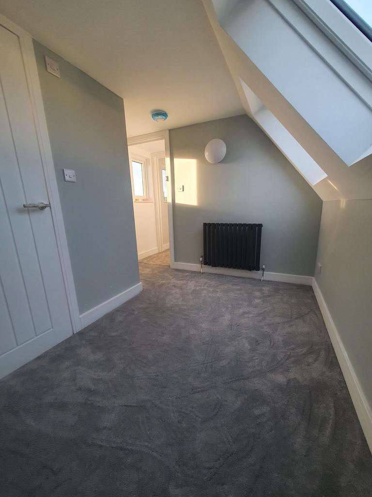 A bright and clean hallway with modern decor, p...