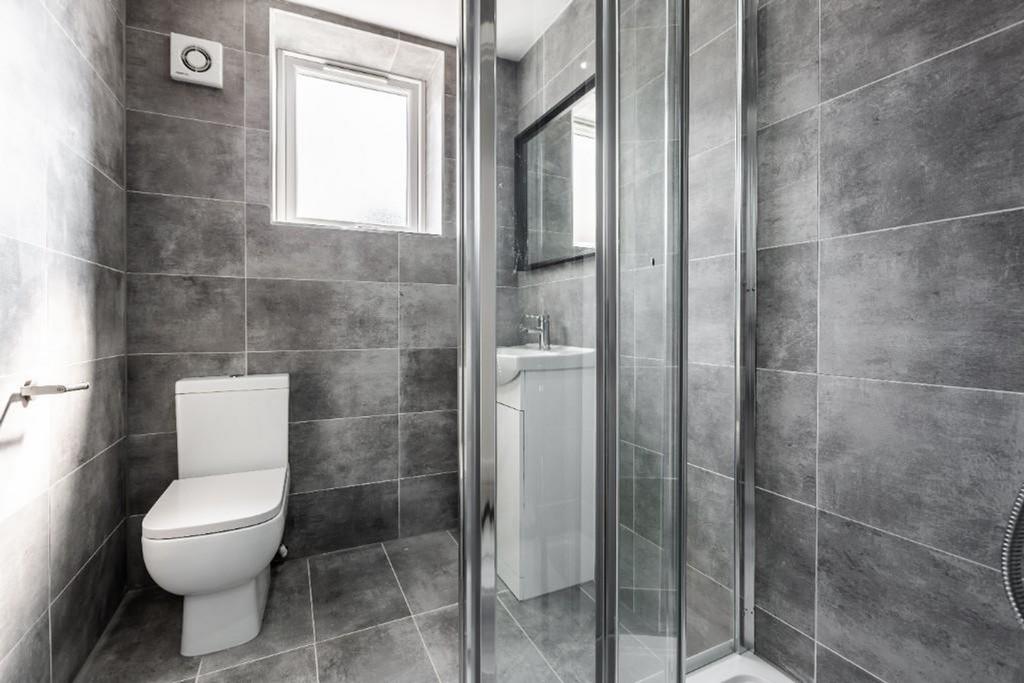 A modern and sleek bathroom featuring a stylish...