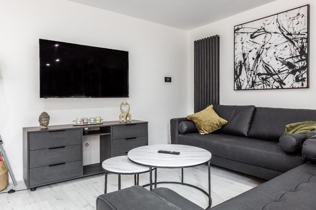 A stylish and spacious modern living room, perf...