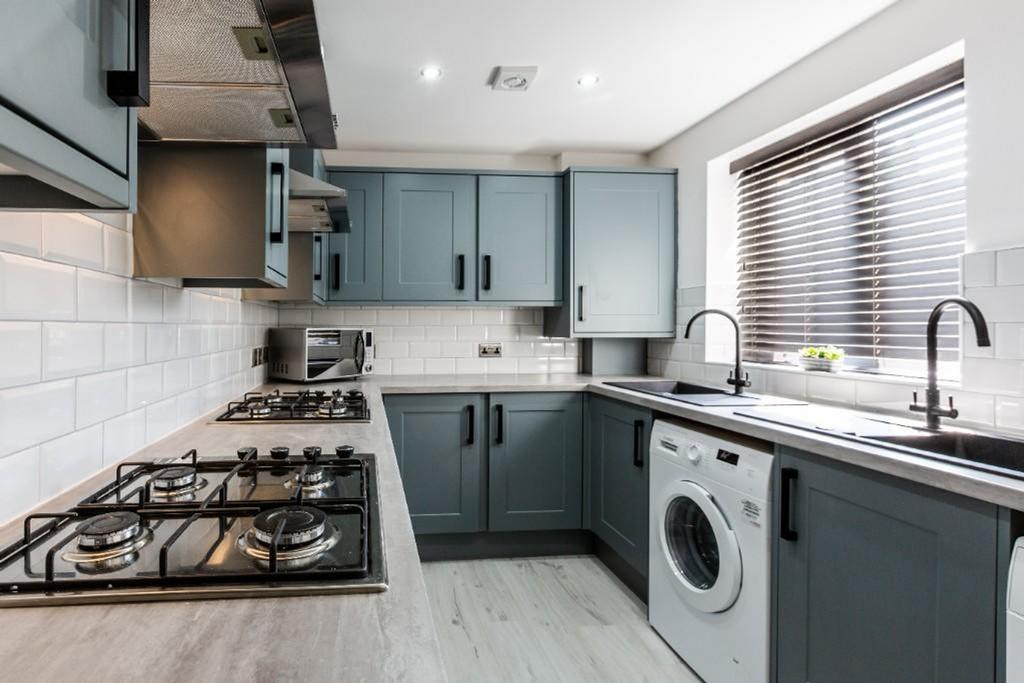 A modern and well-equipped kitchen featuring st...