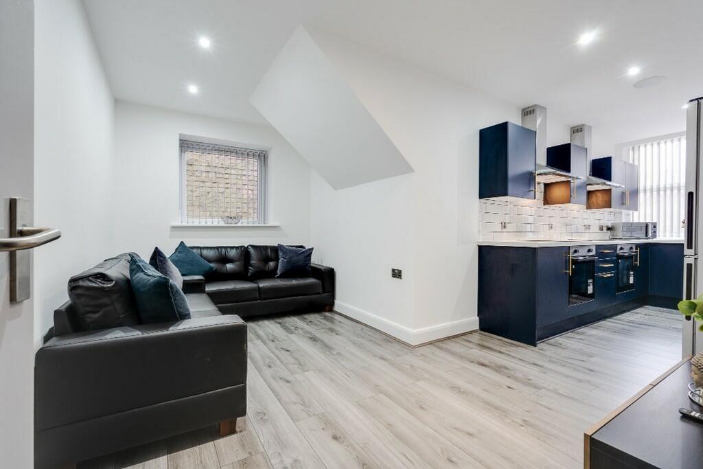A stylish and spacious modern living room, perf...