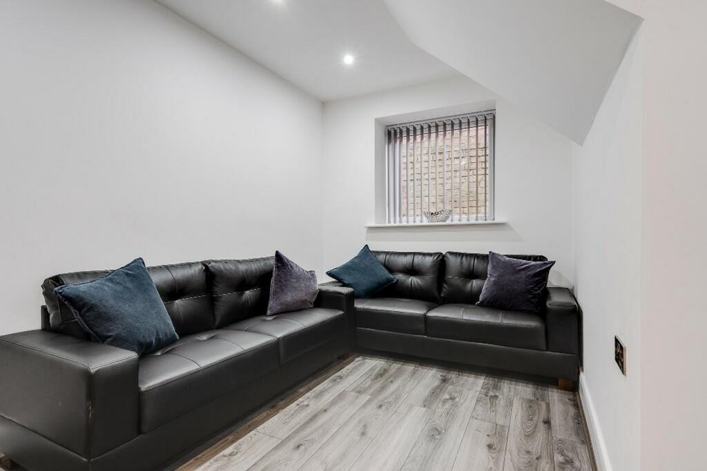 A stylish and inviting living room featuring co...