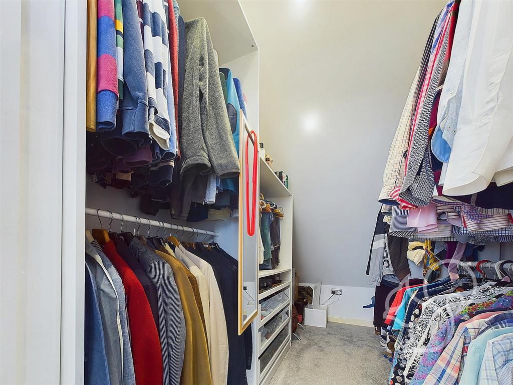 Principal bedroom walk in wardrobe