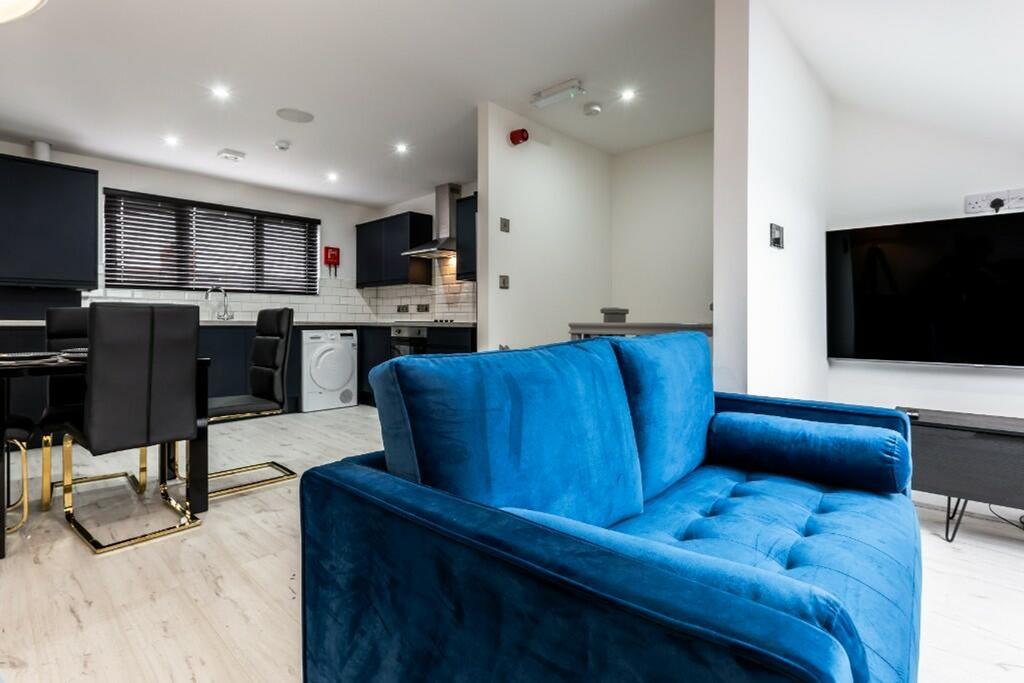 Stylishly designed living room featuring a cozy...